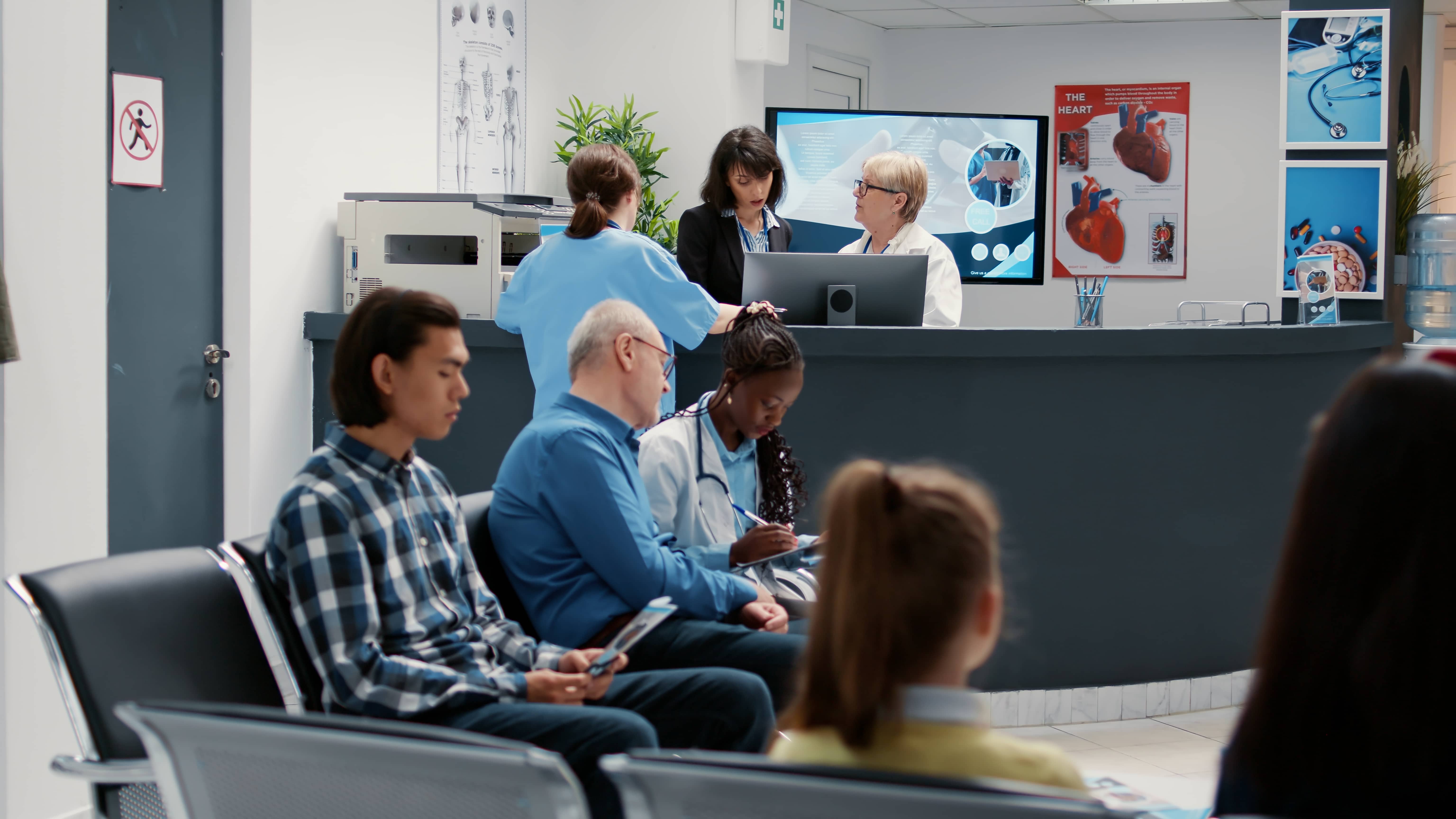 Waiting room in hospital lobby with reception counter desk